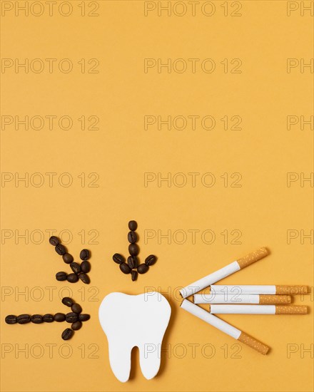 Flat lay tooth shape with coffee beans