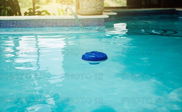 A chlorine float in a swimming pool. Dosing float for swimming pool chlorination