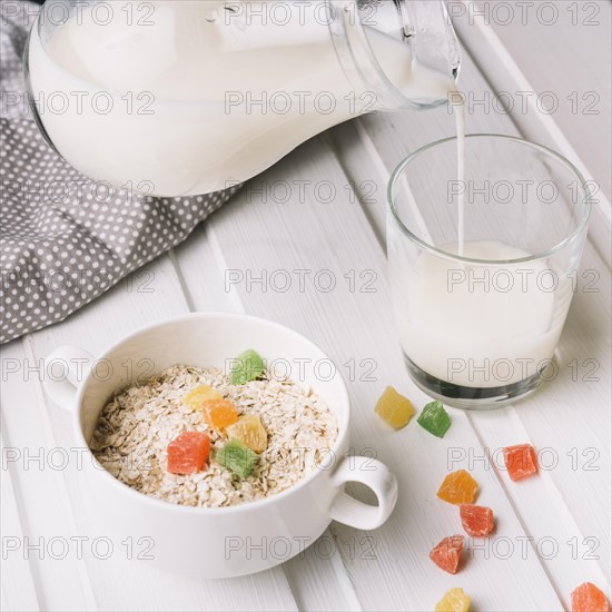 Overhead view oatmeal with glass milk white table