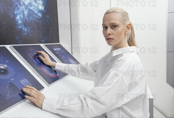 Side view woman working digital monitors
