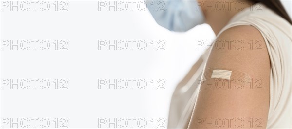Bandage young woman s arm