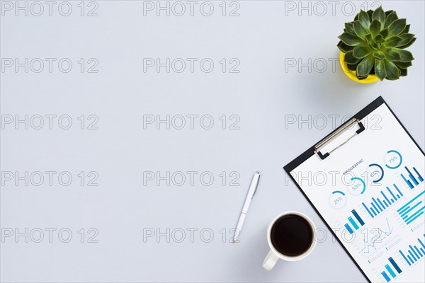 Top view desk concept with clipboard