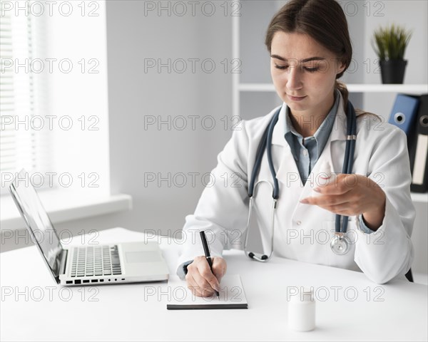 Doctor writing medical prescription