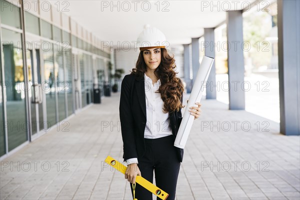 Young businesswoman with plan level