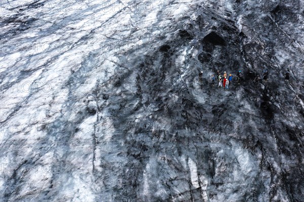 Climbers and tourists on Solheimajoekull glacier tongue