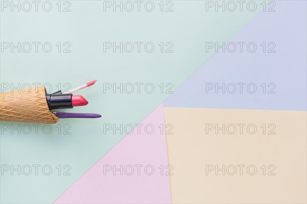 Makeup cosmetics product ice cream cone different colored background