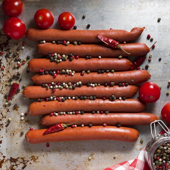 Top view sausages with pepper cherry tomatoes