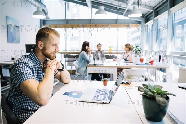 Man sitting laptop office