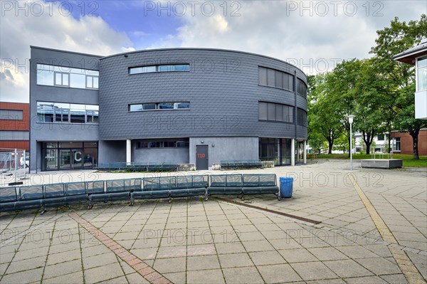 Grey facade on round building