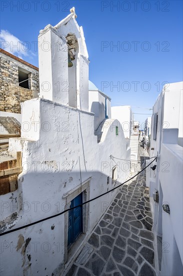 Small white church and Cycladic houses