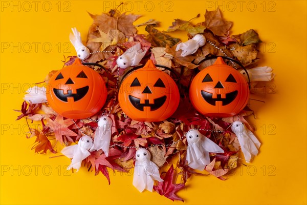 Halloween orange pumpkins on a background of yellow