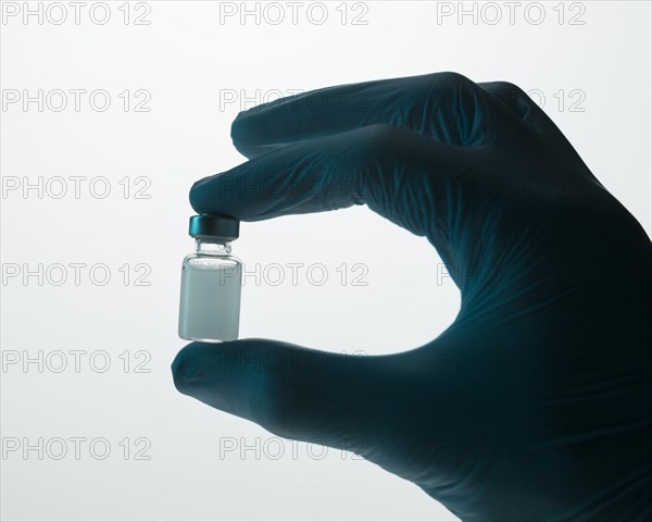 Doctor holding vaccine hand