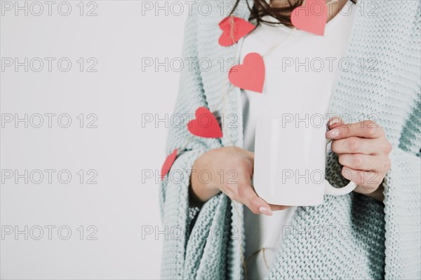 Crop woman plaid holding cup