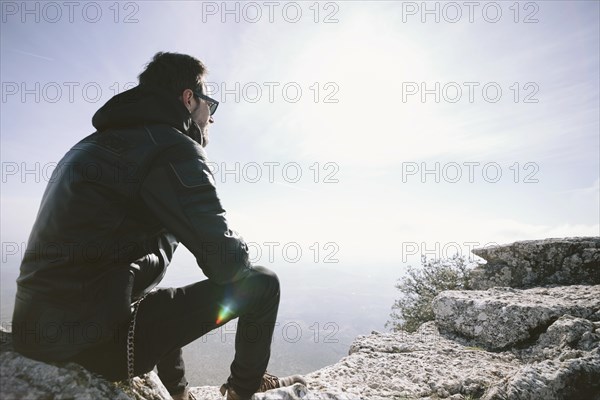 Man sitting rock