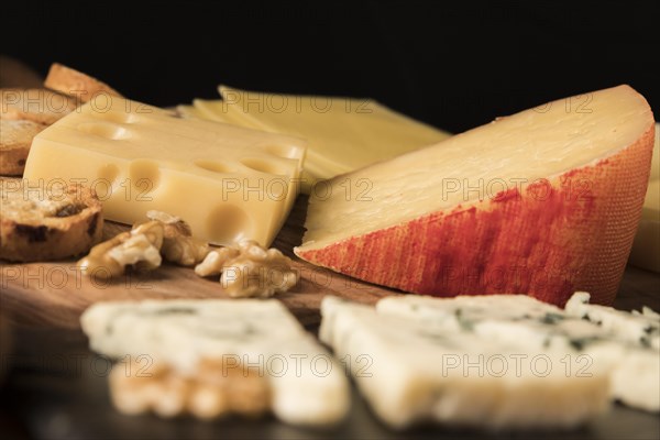 Variation tasty cheeses wooden table