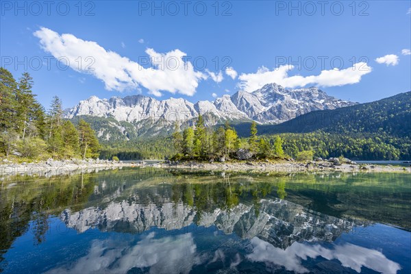 Zugspitze massif and Zugspitze reflected in Eibsee lake