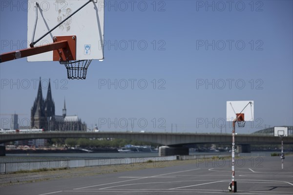 Basketball court on the banks of the Rhine in Deutz in front of the cathedral and Severinsbruecke