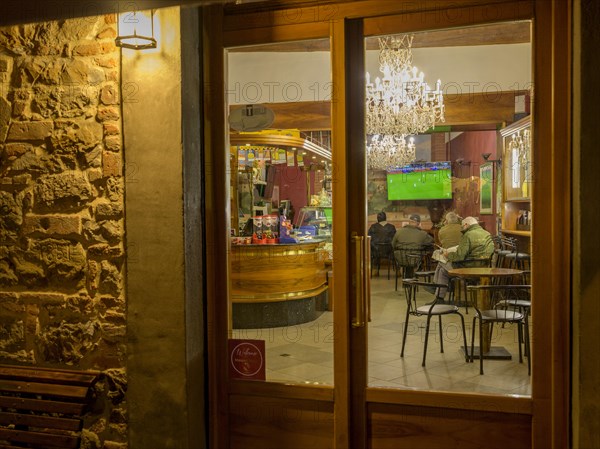 View of a restaurant in the old town in the evening