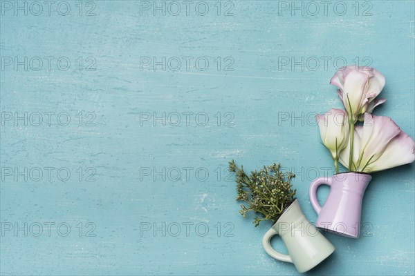 Beautiful vases blue textured wooden background