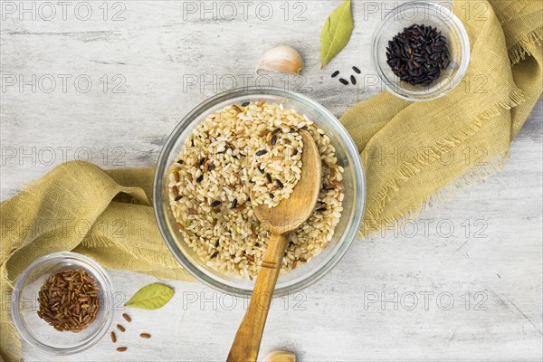 Different rice types bowls with spoon table