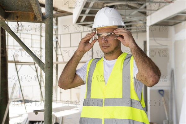 Worker construction wearing protection gear