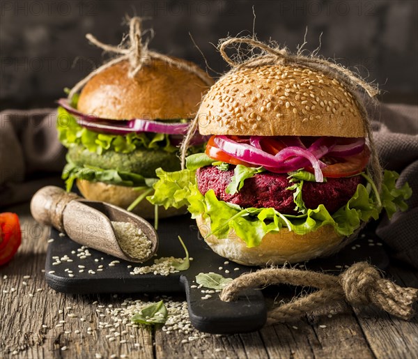 Front view vegetarian burgers cutting board