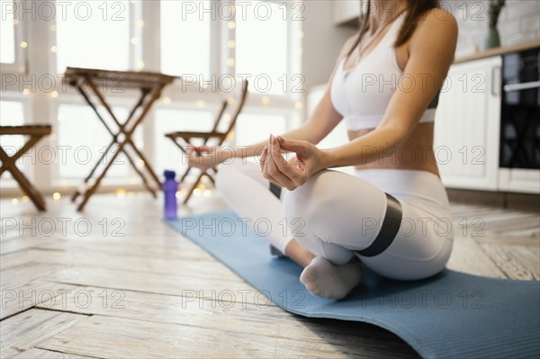 Close up woman meditating home