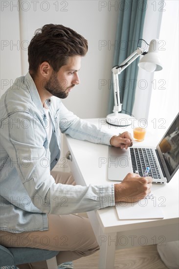 Casual adult male working from home