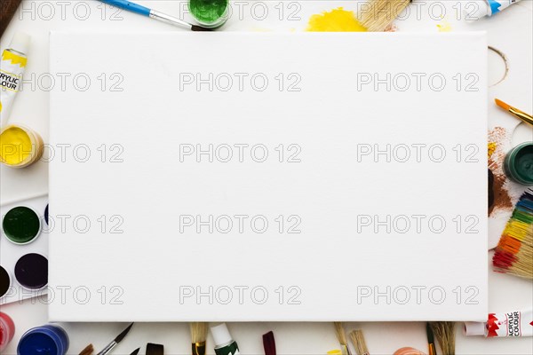 Copy space white canvas art studio items