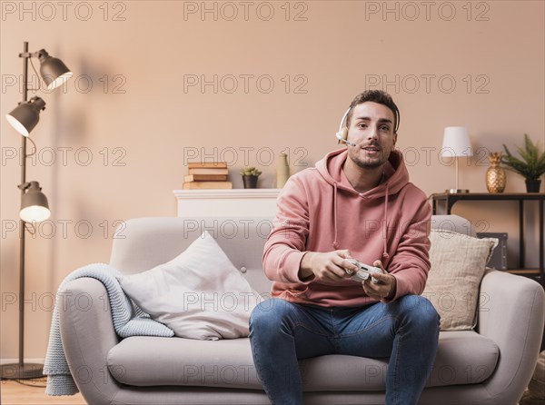 Man with headphones playing