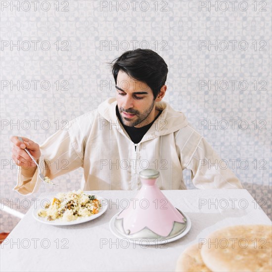 Muslim man eating