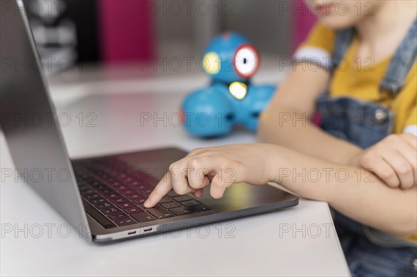 Kid typing keyboard