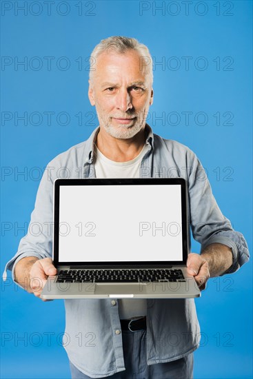 Modern senior man with laptop
