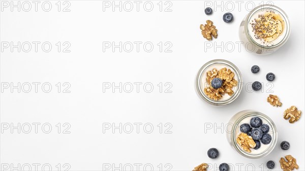 Top view mix yogurt fruits with copy space