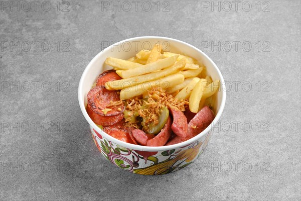 Takeaway snack or lunch in cardboard bowl. Sausage