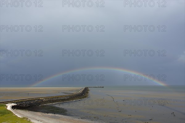 View from the radar tower of Minsener Oog Island onto the jetty with rainbow