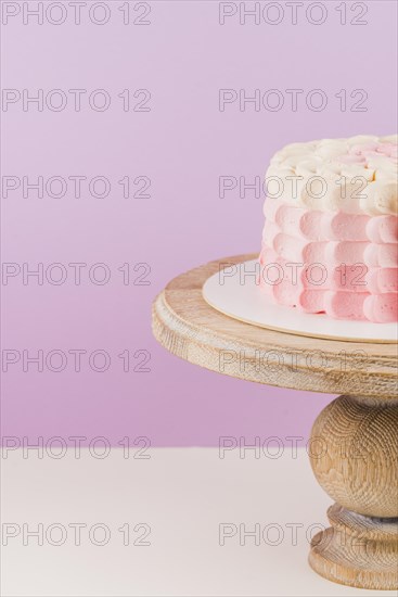 Close up birthday cake wooden cakestand