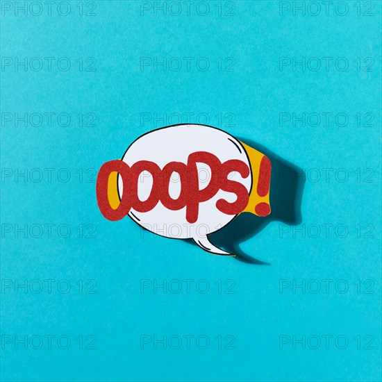 Pop art comic design oops speech bubble blue backdrop