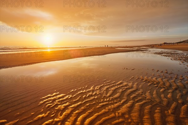 Atlantic ocean sunset with surging waves at Fonte da Telha beach