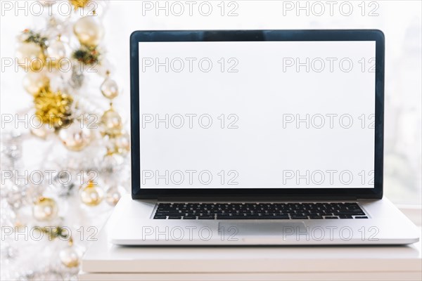 Laptop table near christmas tree