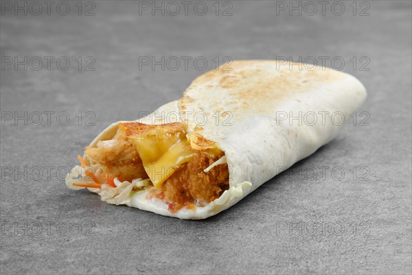 Flatbread stuffed with hake fillet in breading