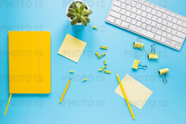 Bright desktop with computer keyboard diary