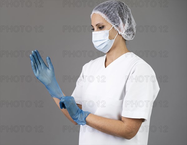 Medium shot woman wearing gloves