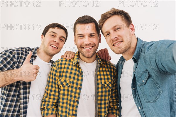 Portrait smiling young male friends looking camera