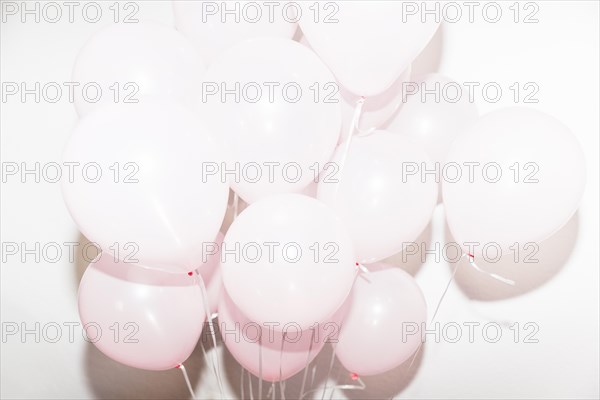 Inflatable birthday balloons against white backdrop