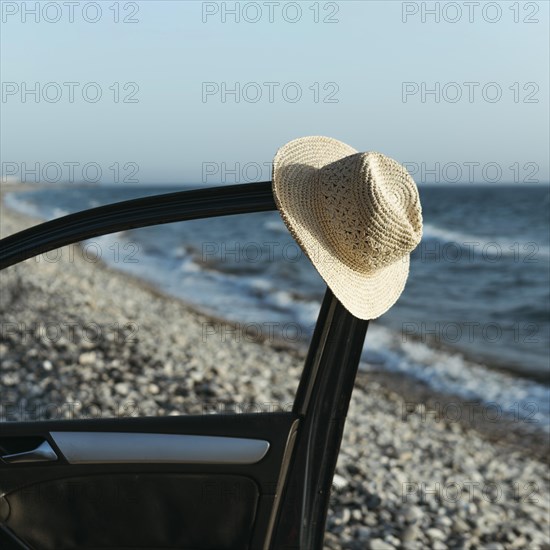 Hat hanging off car door