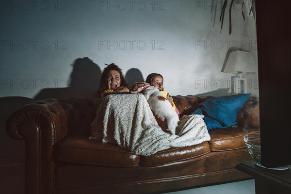 Frightened kids watching movie