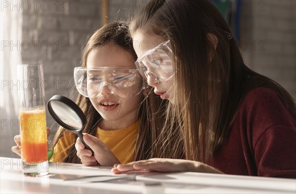 Girls with magnifying glass