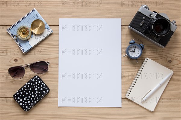 Travel items wooden background