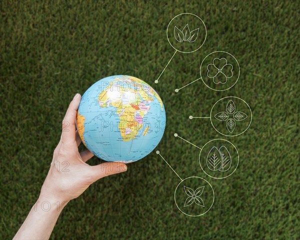 Close up woman holding earth globe